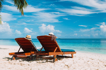 Two chairs on the tropical beach