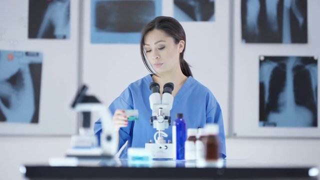  Medical researcher working in the lab analyzing pharmaceuticals