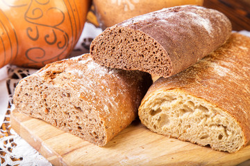 Sliced rye bread on cutting board closeup