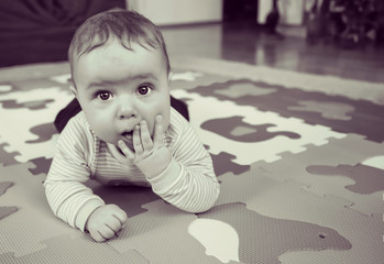 Naklejka premium Little baby is upset about something