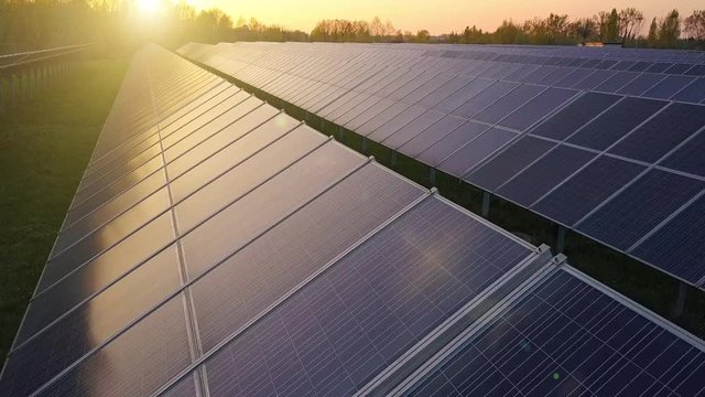 solar panels aerial shot at sunset