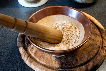 gomasio, made of sesame seeds and hymalaian pink salt, suribachi and surikogi macrobiotic diet tools