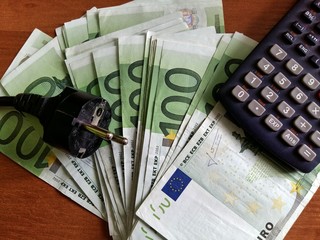 electricity bill and 100 euro banknote