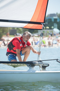 professional waterman training on lake with catamaran