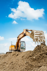 excavator in construction site © ABCDstock