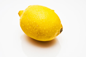 Yellow lemon on the white background