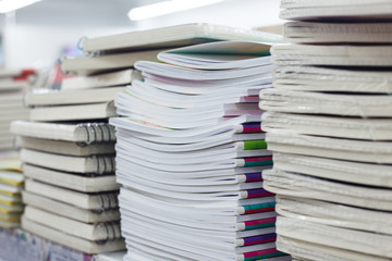 Stacks of notebooks in chancery shop  closeup