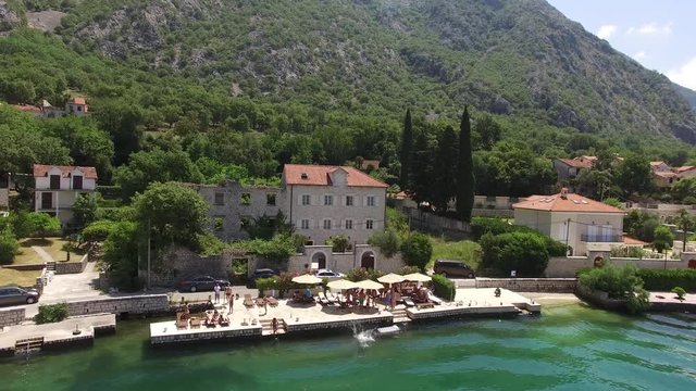 The villa is in the village of Ljuta. Montenegro, Kotor Bay, Adriatic sea. Aerial Photo drone.