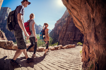 Hikers moving forward on the stone path in the Bryce canyon, USA