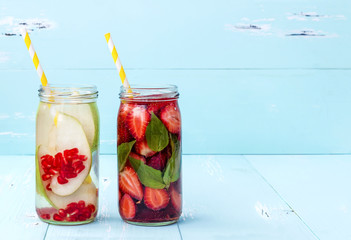 Fototapeta na wymiar Detox fruit infused flavored water. Refreshing summer homemade cocktail. Clean eating. Copy space
