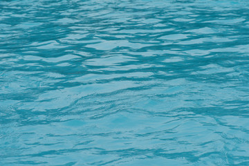Blue water surface and ripple wave in pool