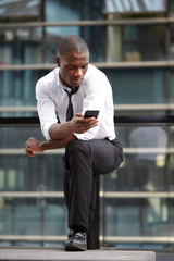 young african american businessman using smart phone
