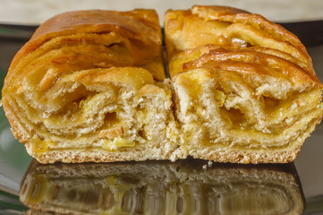two pieces of lemon biscuit pie on black plate