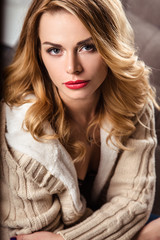 Fototapeta premium beautiful sexy young woman in a lingerie and warm clothes, casual style. fashion beauty portrait