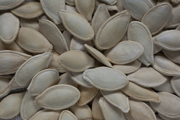 Nature pumpkin seeds background. Autumn food