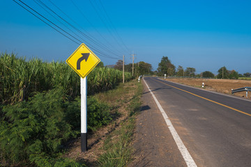 sunset in clouds with sunrays over road to horizon