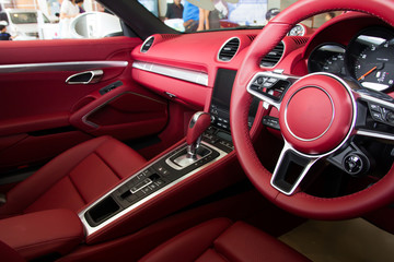 Luxury car Interior - steering wheel, shift lever and dashboard