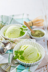 Matcha tea ice cream in white bowl