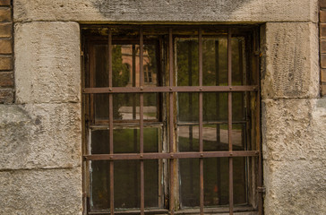 Fototapeta na wymiar Close up of a window with metal lattice