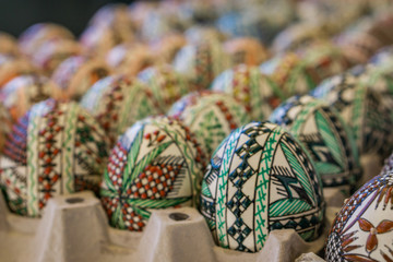 Closeup of factory-made decorated wooden Easter egg. Concept Easter.