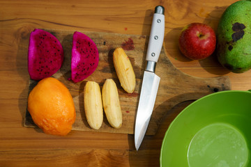 tropical fruit on wood background