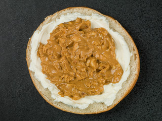 Cream Cheese and Crunchy Peanut Butter Spread Bagel