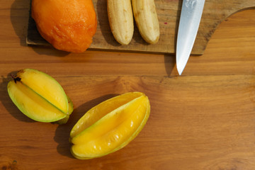 tropical fruit on wood background