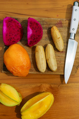 tropical fruit on wood background