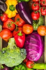 Set of raw vegetables in the wooden tray