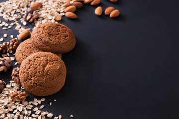 Flat lay shot of oat cookies on dark background