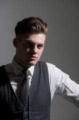 Fototapeta premium Handsome man or fashion model with stylish haircut