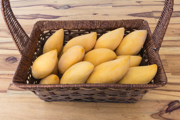 mango in basket on table vintage