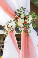 floral decorations of roses and chrysanthemums on a wedding ceremony