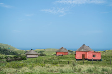 Fototapeta na wymiar Coastline with Traditional Round Houses at Coffee Bay, Eastern Cape, South Africa