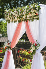 wedding arch for the ceremony flowered roses and chrysanthemums