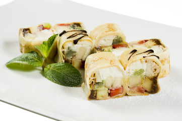 sweet dessert wrapped in a roll of sushi rolls on a plate