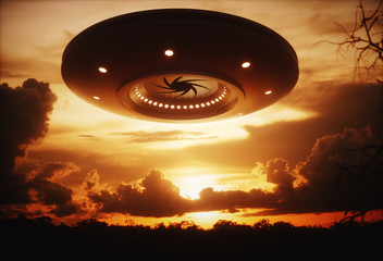 UFO Alien spaceship under the sunset. © ktsdesign
