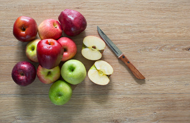 Pile of fresh apple put on old wooden background