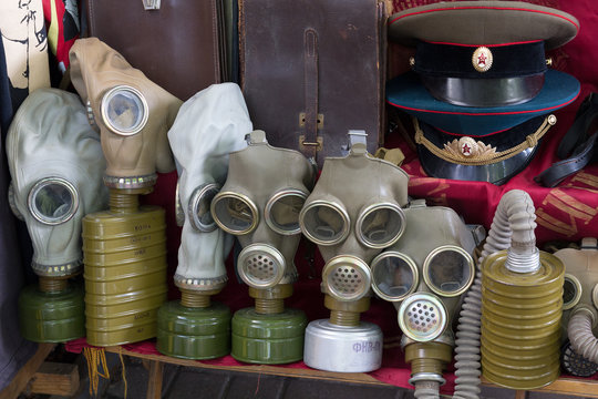  Gas masks and a Soviet military uniform on the flea market. Kiev, Ukraine