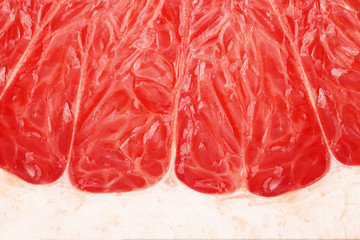 Close up of red grapefruit isolated on white