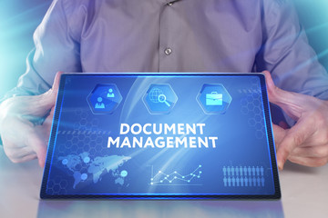 Business, Technology, Internet and network concept. Young businessman working on a virtual screen of the future and sees the inscription: Document management