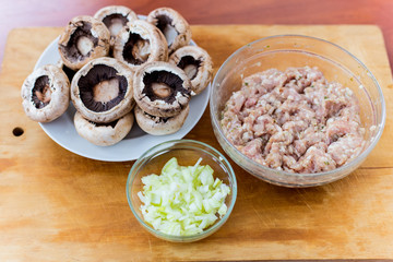 Cooking dishes from mushrooms champignons with meat