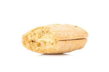 coconut flavor cookie cake with cream filling isolated on white background. bite