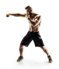 Muscular male in sports clothes сonducts fight with shadow. Photo of boxer on white background....