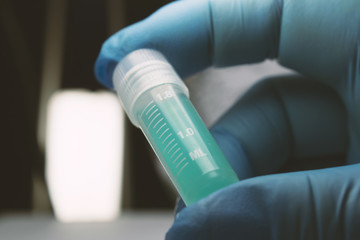 Gloved Hand Holding Research Vial, Stem Cell Research Substance in Vial