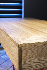 the surface of a wooden table on a background window