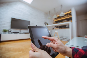 Close up and part of human hand using digital tablet