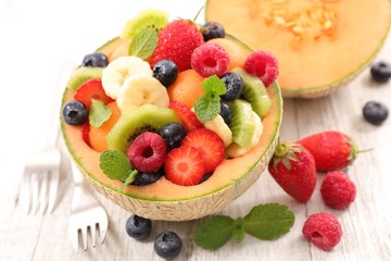 Obraz na płótnie Canvas fruit salad in melon bowl
