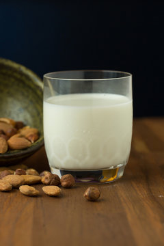 milk and almond on wooden background