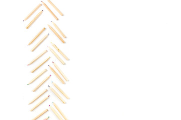 Huge set of colorful pencils on white wooden background. Top view.